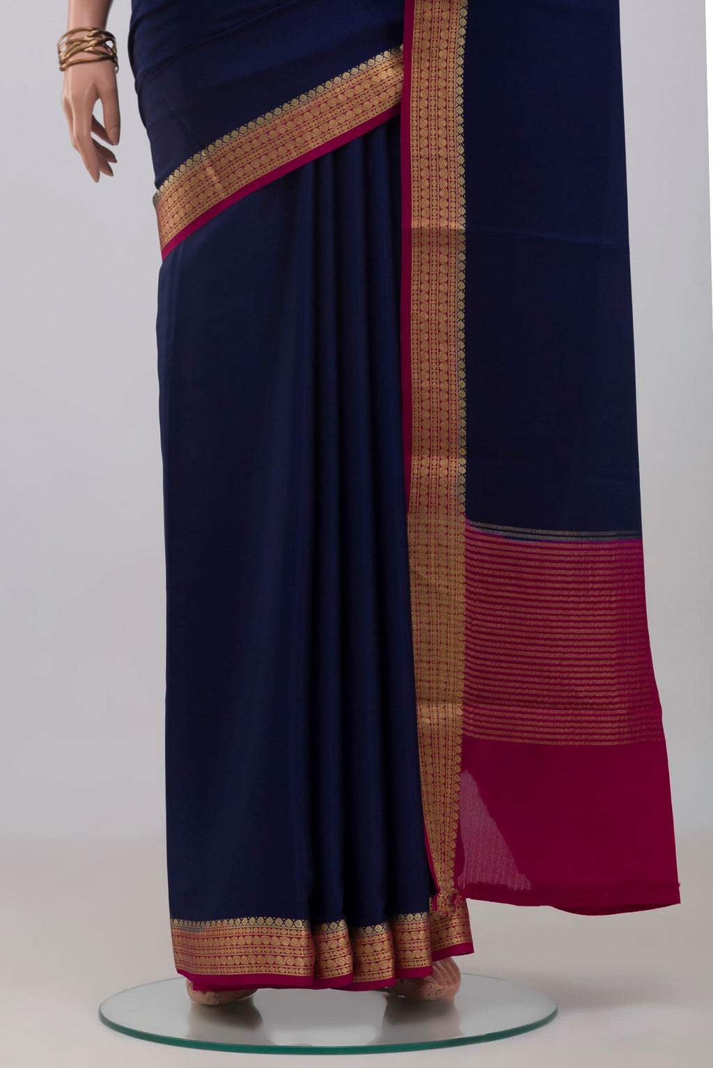 Pleats and pallu of Navy Blue Mysore Crepe Saree with Plain Body and Zari Border. 