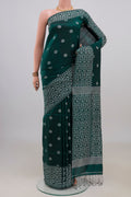 Teal Tussar Saree with Thread Butta on the body and Fancy Border.  displayed on a mannequin