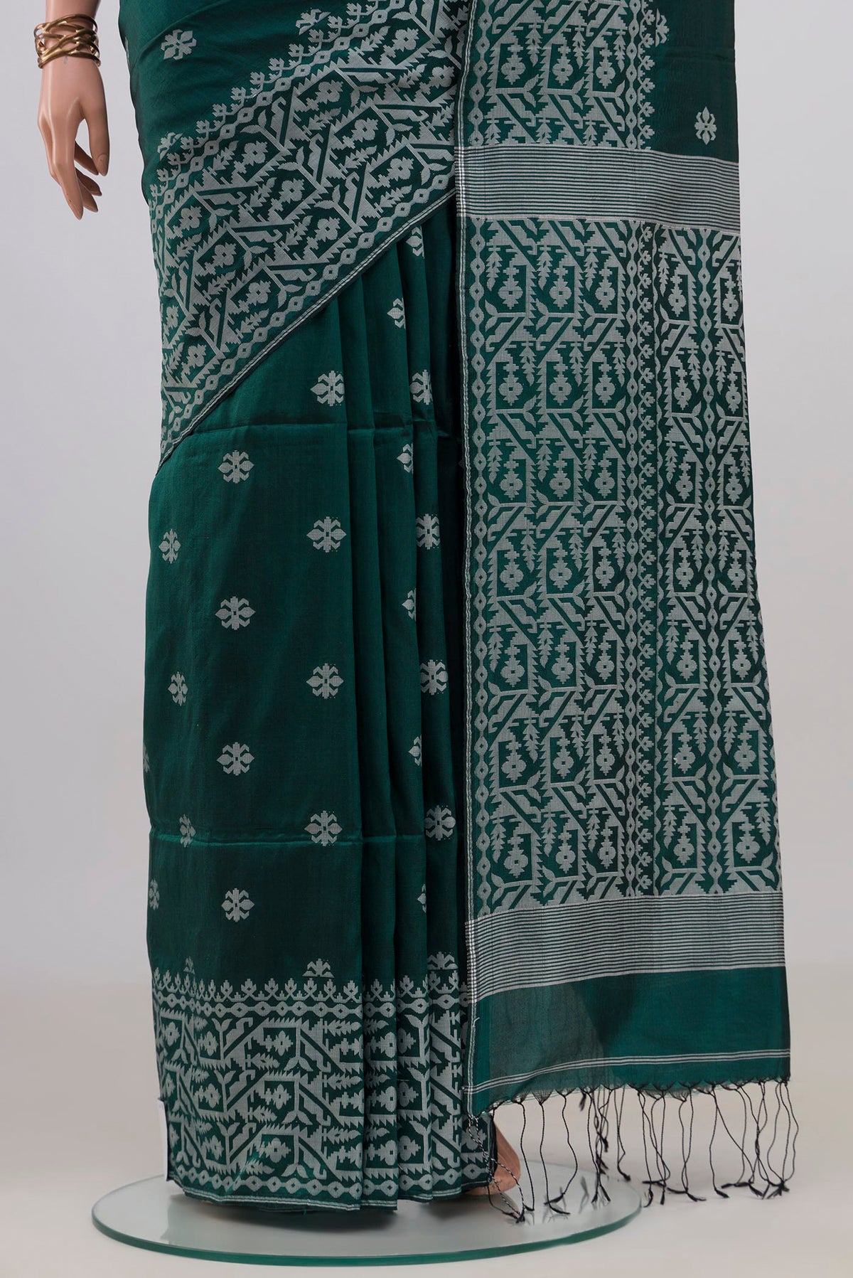 Pleats and pallu of Teal Tussar Saree with Thread Butta on the body and Fancy Border. 