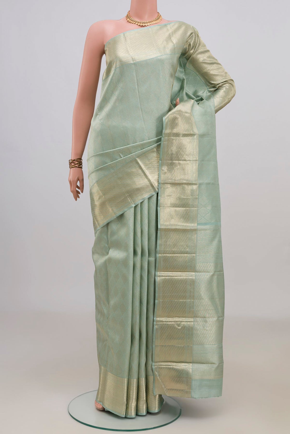 Pure Silk Light Blue Kanchipuram Saree with Zari Brocade on the body and Zari Border.  displayed on a mannequin