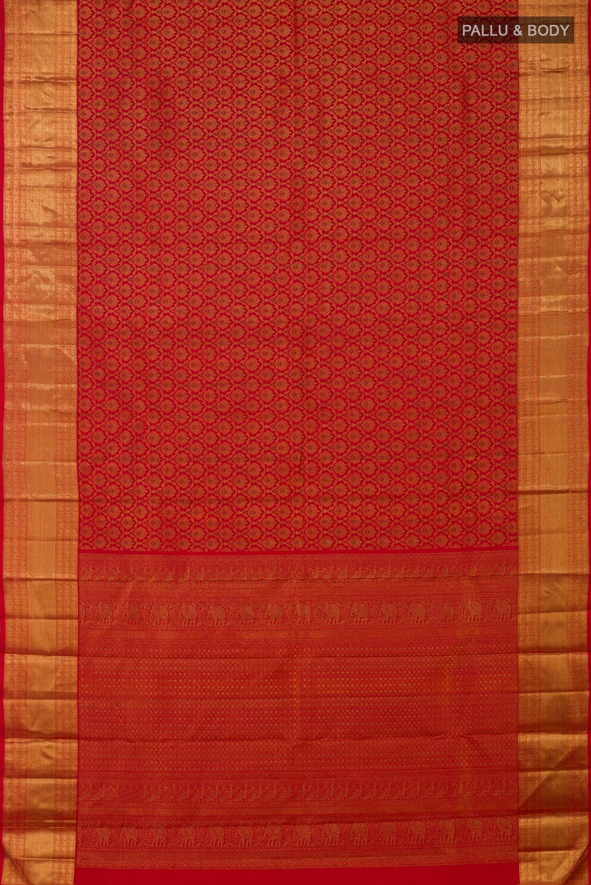 Flat view of Red Kanchipuram Silk Saree with Zari Brocade on the body and Zari Border. 