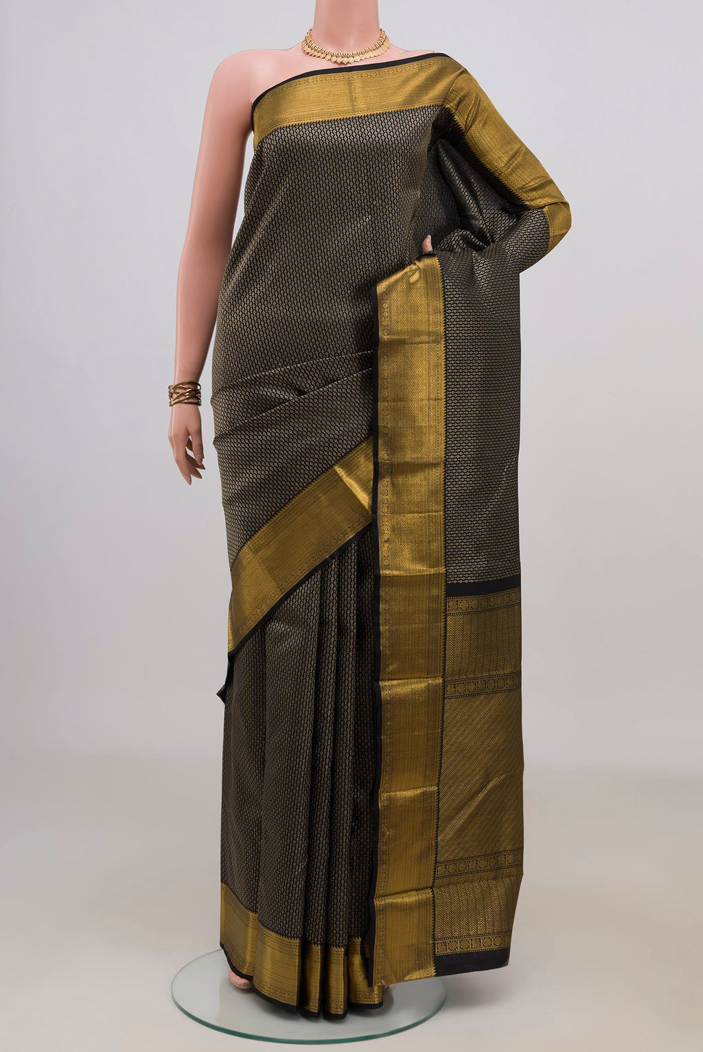 Pure Silk Black Kanchipuram Saree with Zari Brocade on the body and Zari Border.  displayed on a mannequin