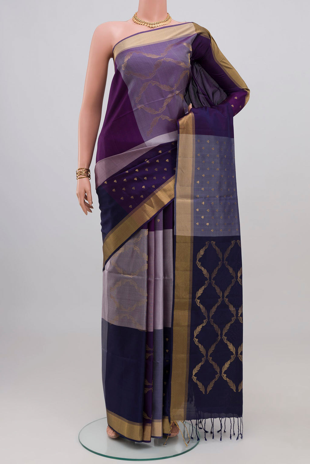 Multi Color Soft Silk Saree with Zari Butta on the body and Zari Border.  displayed on a mannequin