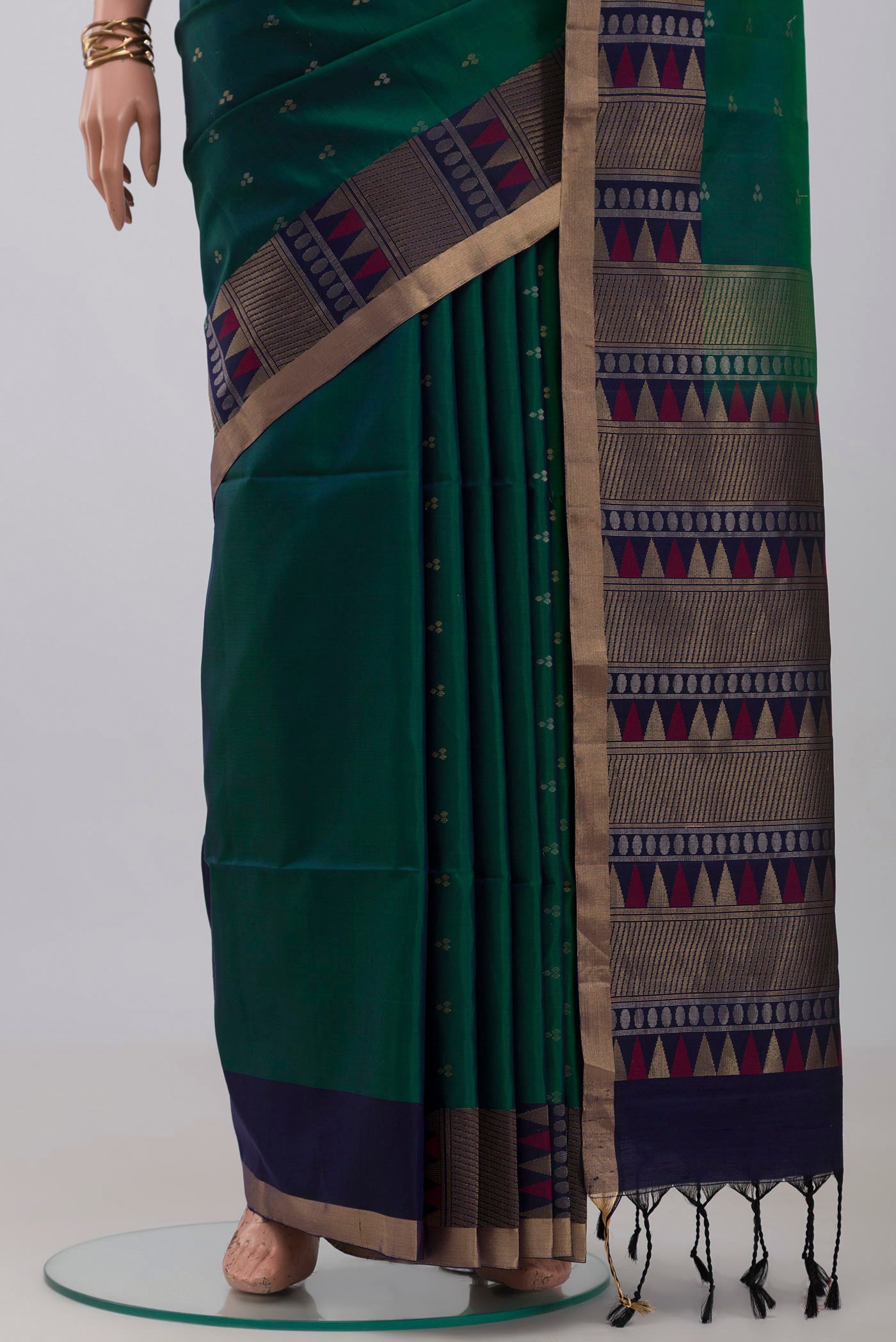 Pleats and pallu of Green Soft Silk Saree with Zari Butta on the body and Fancy Border. 
