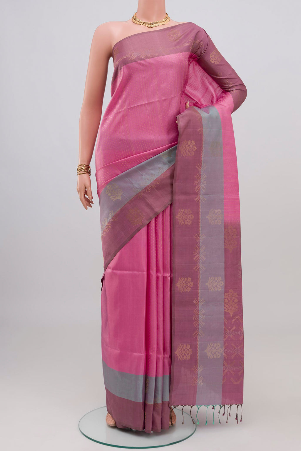 Rose pink Soft Silk Saree with Zari Butta on the body and Fancy Border.  displayed on a mannequin