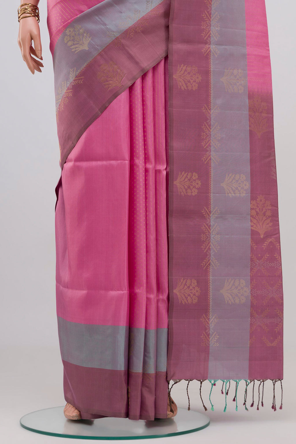 Pleats and pallu of Rose pink Soft Silk Saree with Zari Butta on the body and Fancy Border. 