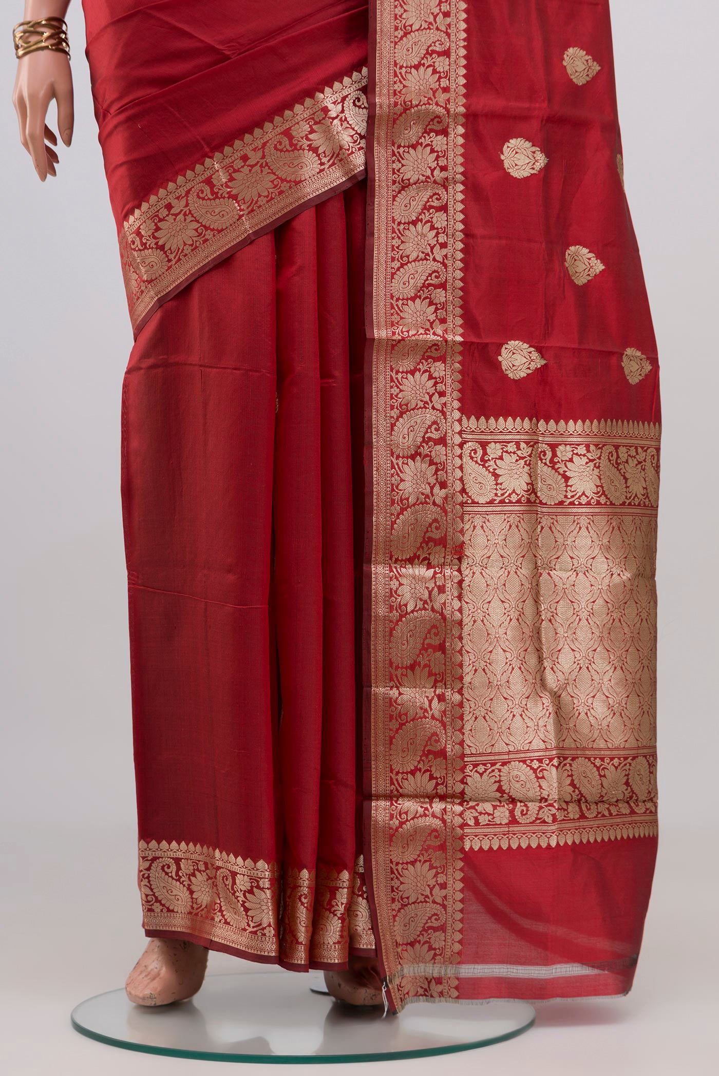 Pleats and pallu of Maroon Banarasi Katan Silk Saree with Zari Butta on the body and Zari Border. 