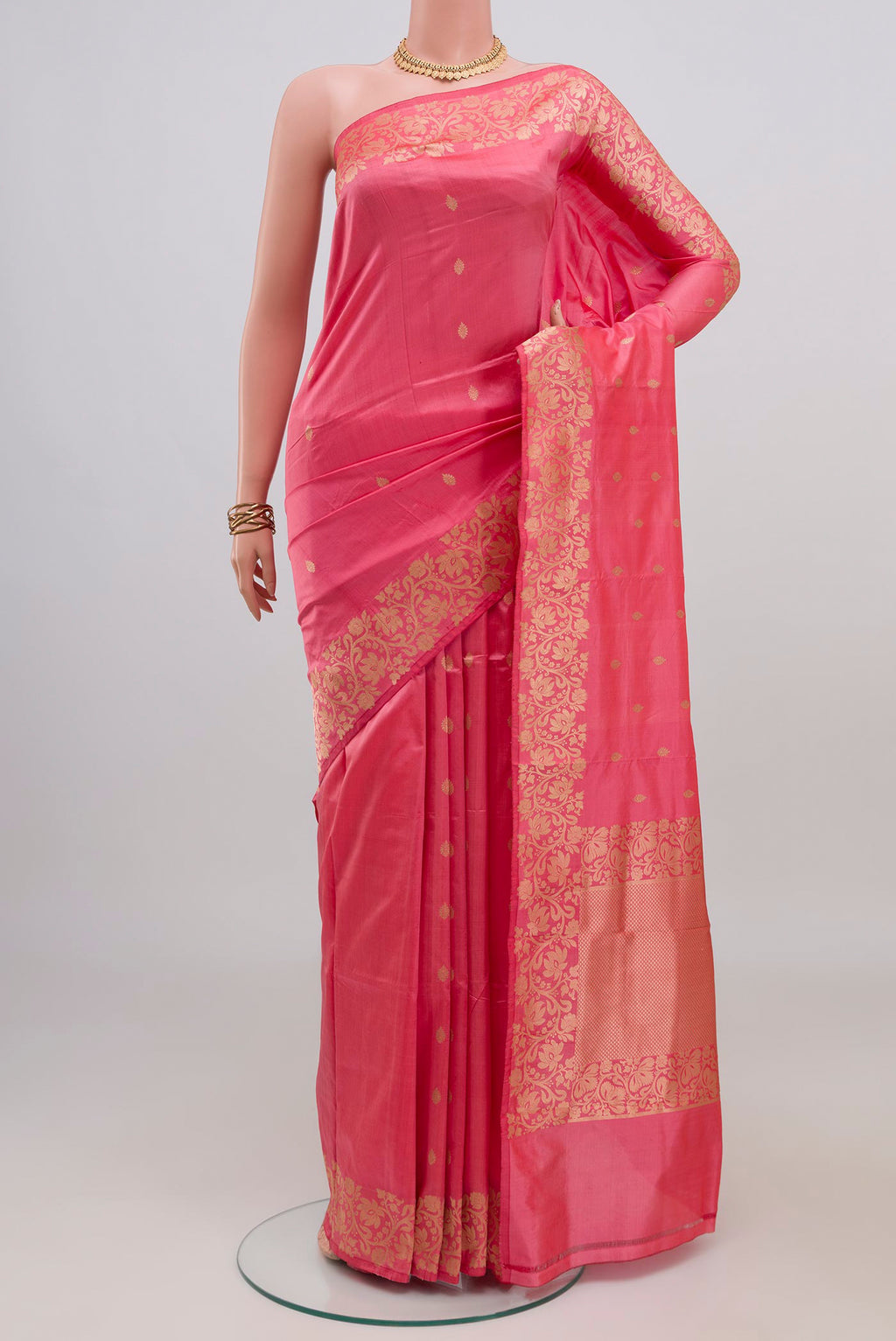 Pink Banarasi Katan Silk Saree with Zari Butta on the body and Fancy Border.  displayed on a mannequin