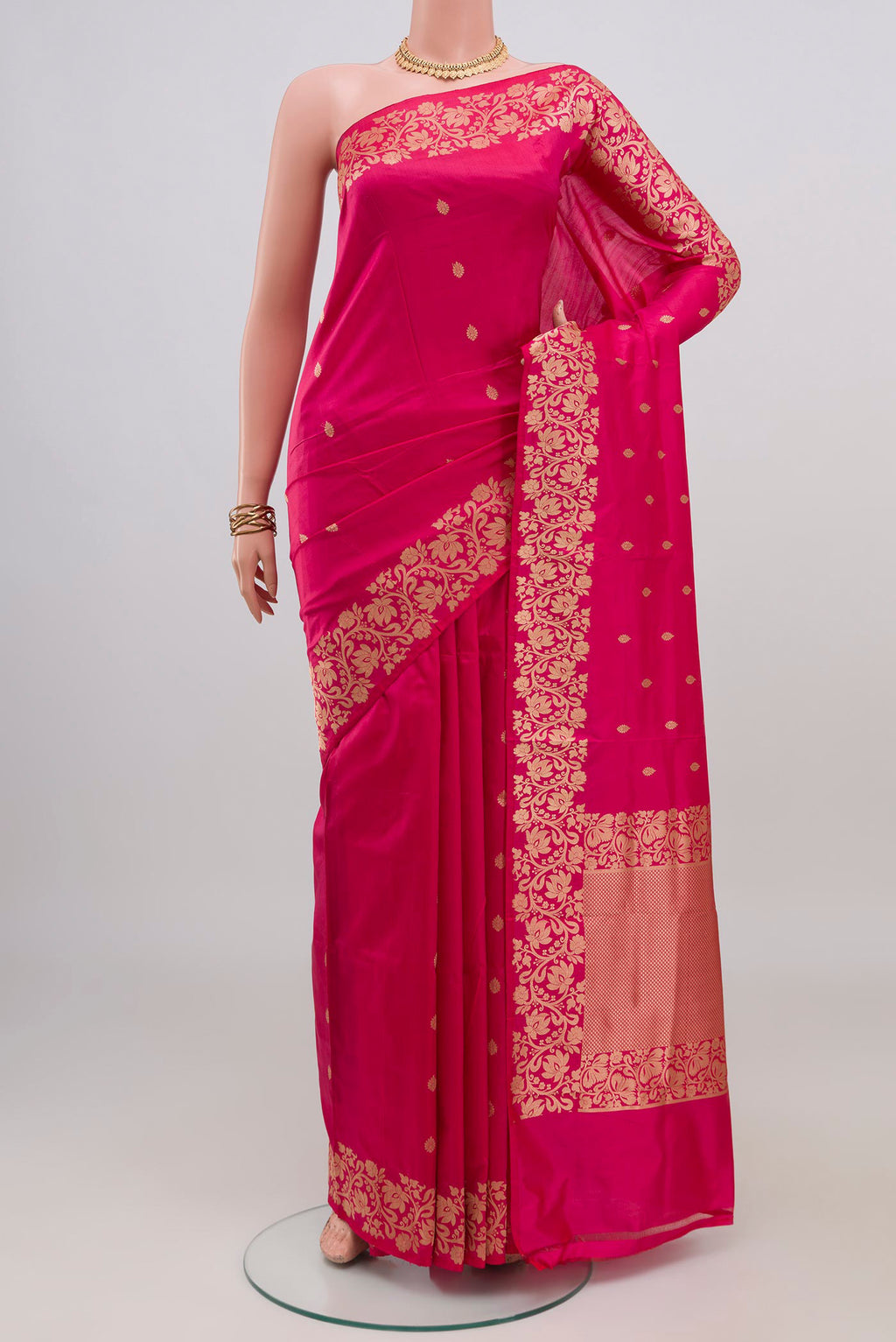 Pink Banarasi Katan Silk Saree with Zari Butta on the body and Fancy Border.  displayed on a mannequin