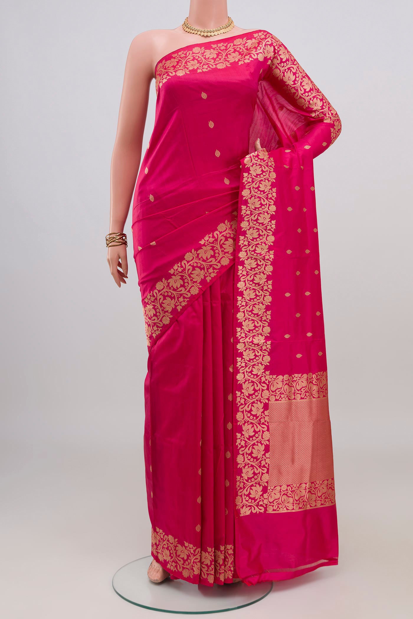 Pink Banarasi Katan Silk Saree with Zari Butta on the body and Fancy Border.  displayed on a mannequin