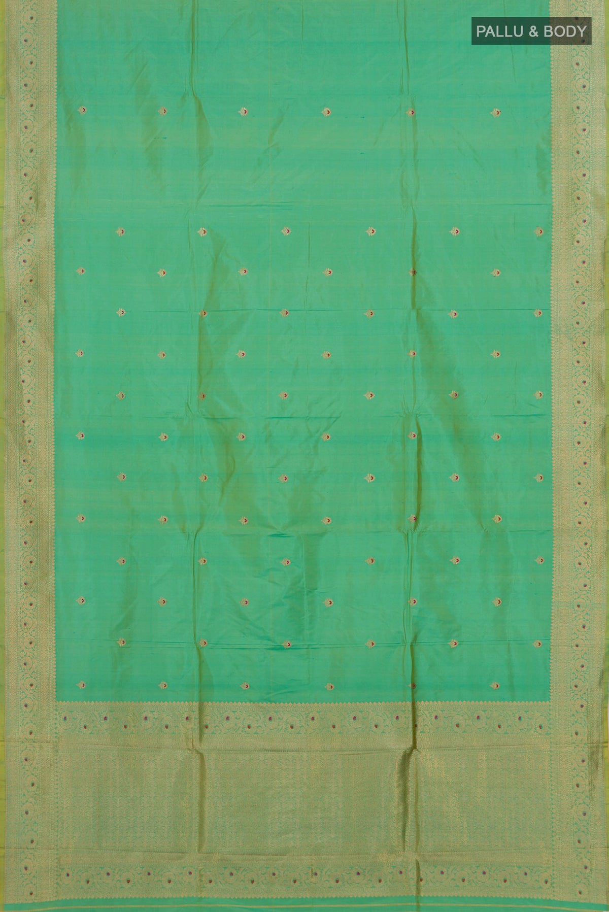 Flat view of Pure Silk Green Banarasi Katan Saree with Zari Butta on the body and Zari Border. 
