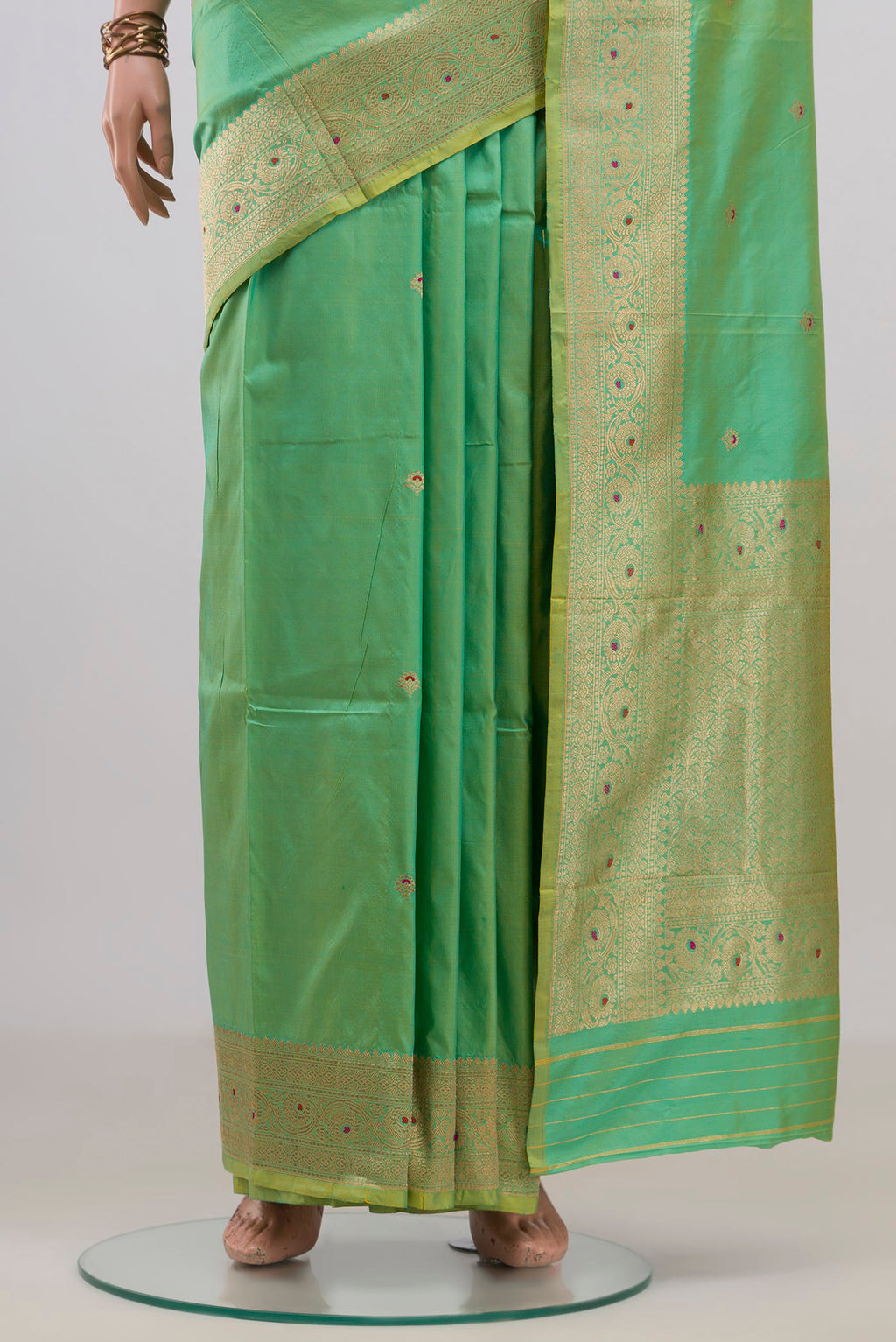 Pleats and pallu of Pure Silk Green Banarasi Katan Saree with Zari Butta on the body and Zari Border. 