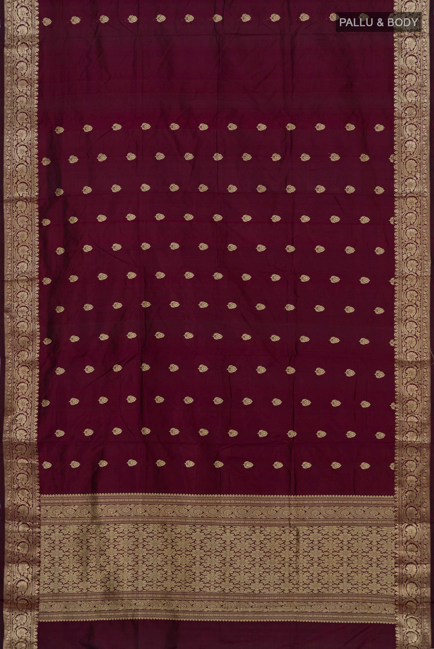 Flat view of Maroon Banarasi Katan Silk Saree with Zari Butta on the body and Zari Border. 