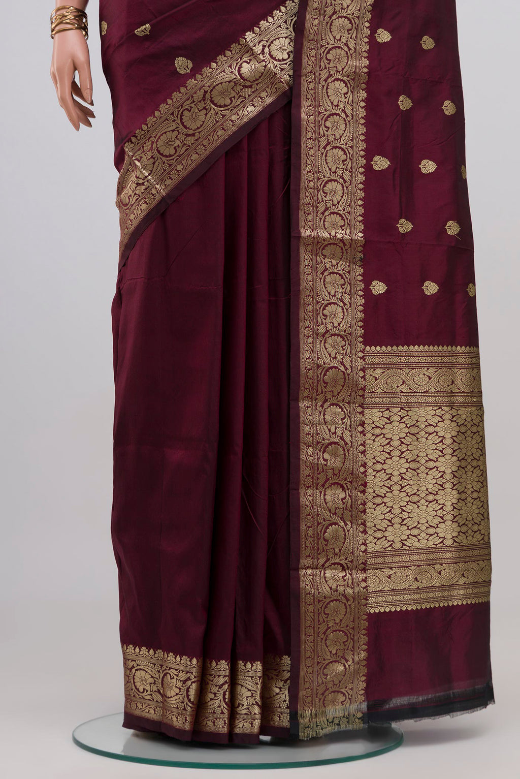 Pleats and pallu of Maroon Banarasi Katan Silk Saree with Zari Butta on the body and Zari Border. 