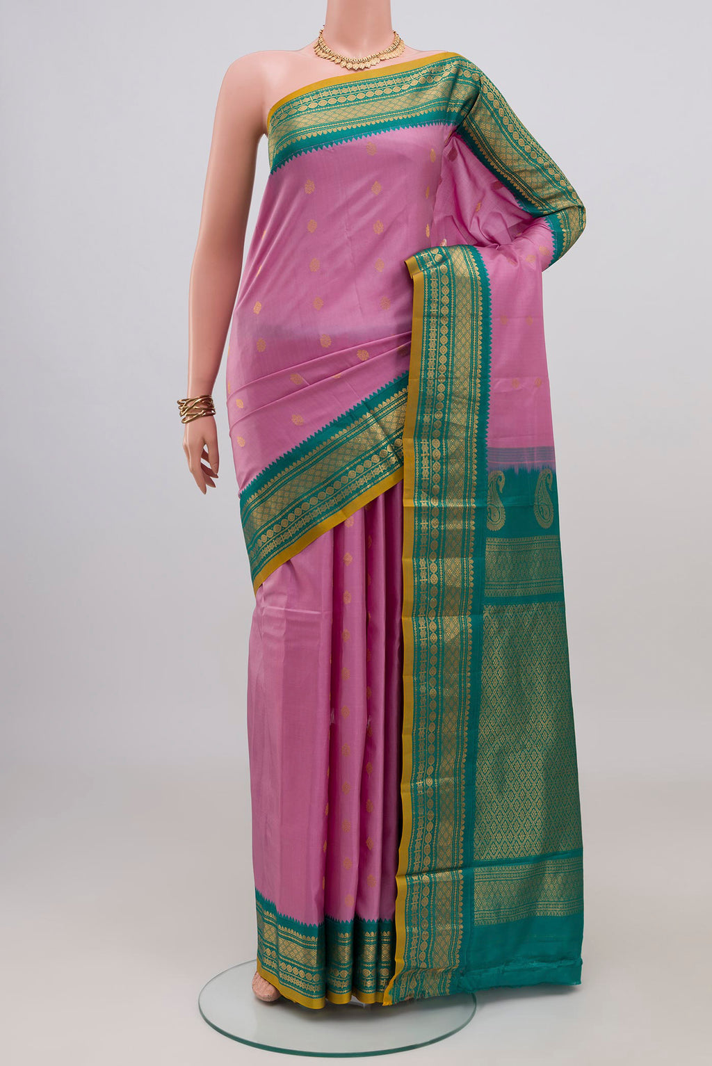 Pink Gadwal Silk Saree with Zari Butta on the body and Zari Border.  displayed on a mannequin