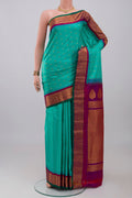 Blue Gadwal Silk Saree with Zari Butta on the body and Zari Border.  displayed on a mannequin