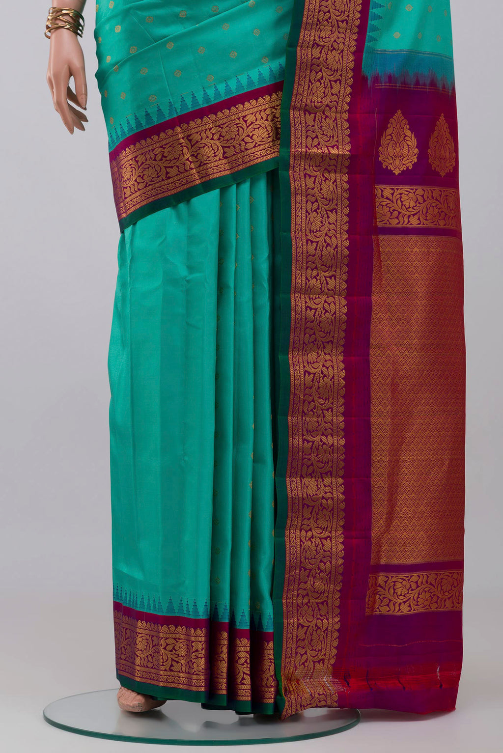 Pleats and pallu of Blue Gadwal Silk Saree with Zari Butta on the body and Zari Border. 