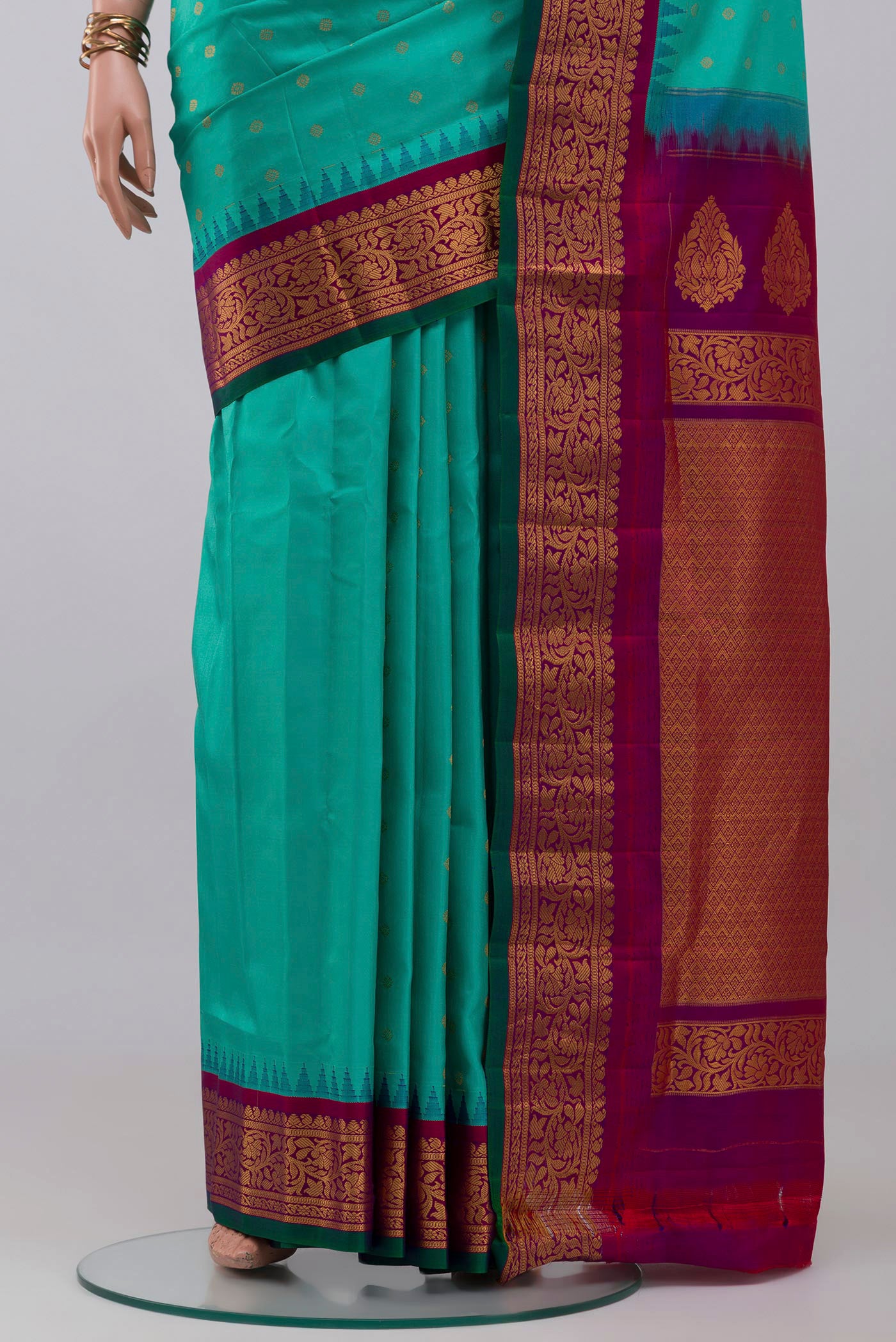 Pleats and pallu of Blue Gadwal Silk Saree with Zari Butta on the body and Zari Border. 