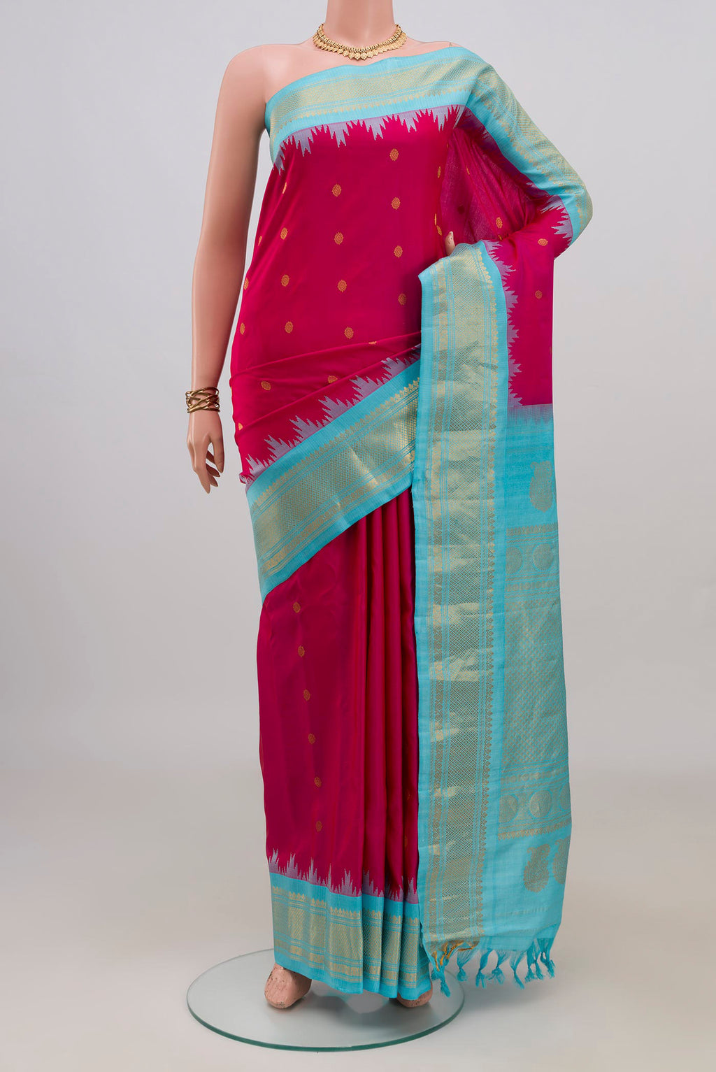 Pure Silk Pink Gadwal Saree with Zari Butta on the body and Zari Border.  displayed on a mannequin