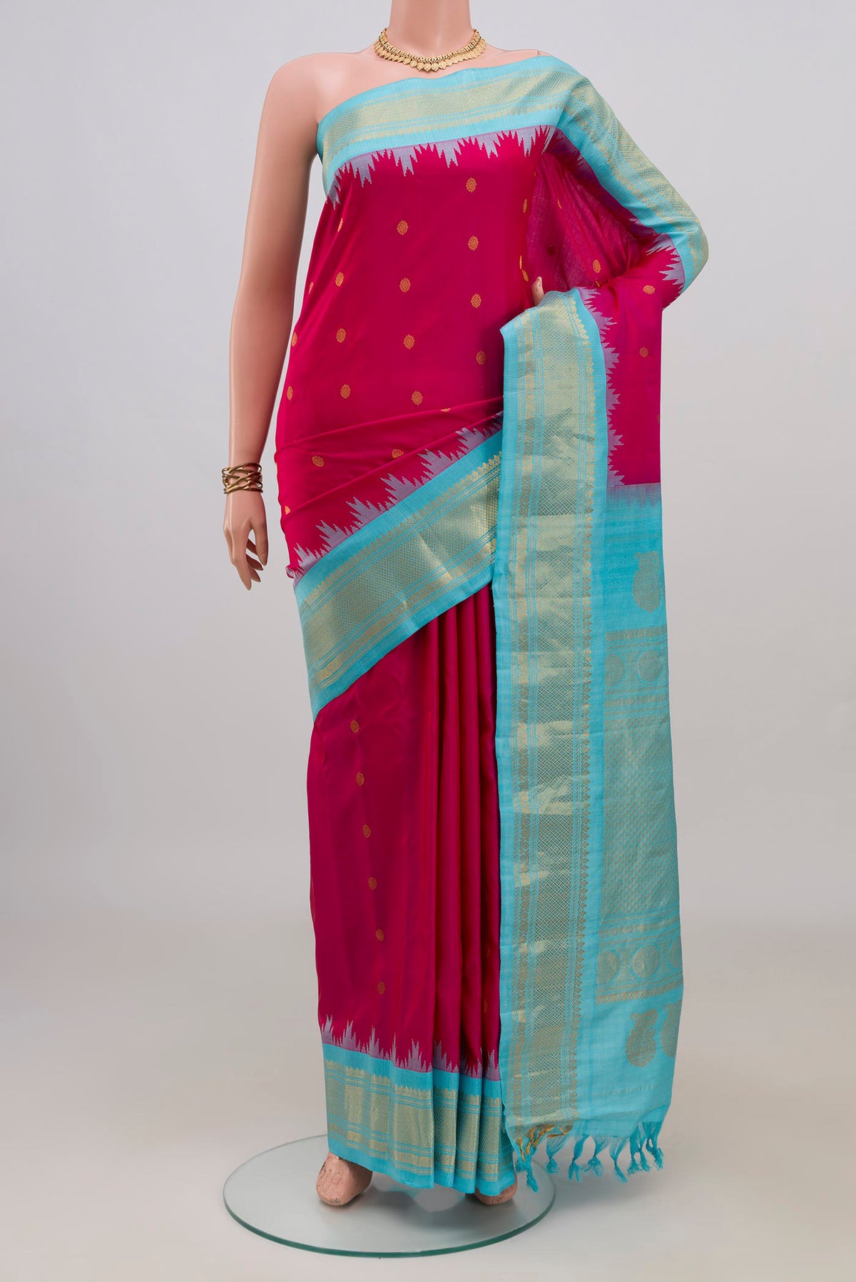 Pure Silk Pink Gadwal Saree with Zari Butta on the body and Zari Border.  displayed on a mannequin