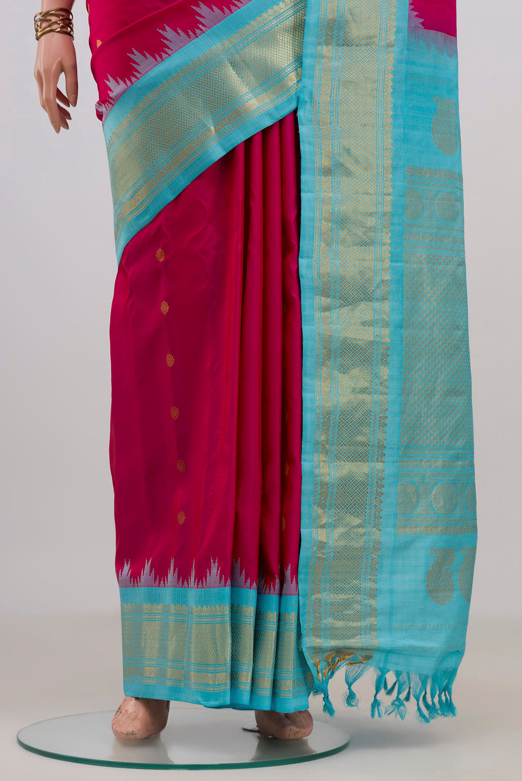 Pleats and pallu of Pure Silk Pink Gadwal Saree with Zari Butta on the body and Zari Border. 