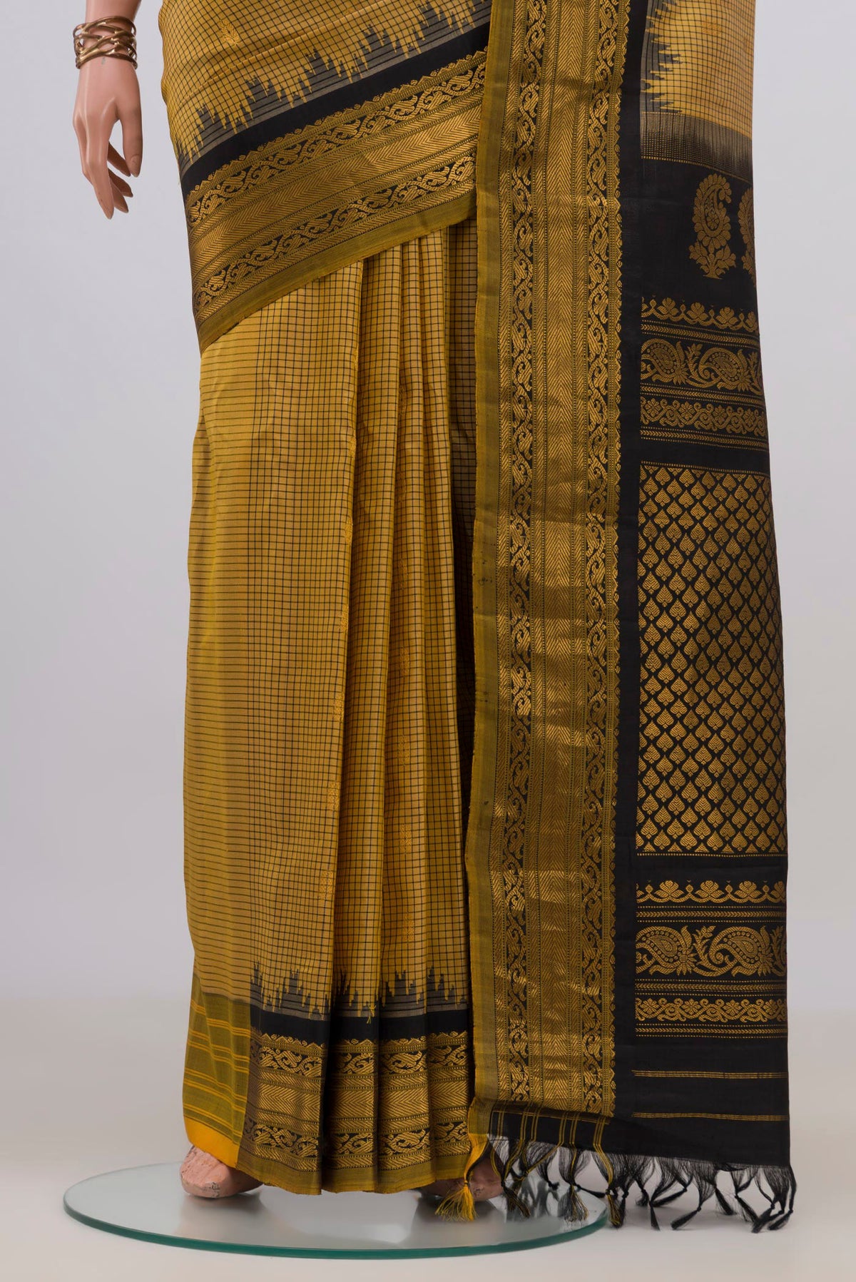 Pleats and pallu of Pure Silk Yellow Gadwal Saree with Checked design on the body and Zari Border. 