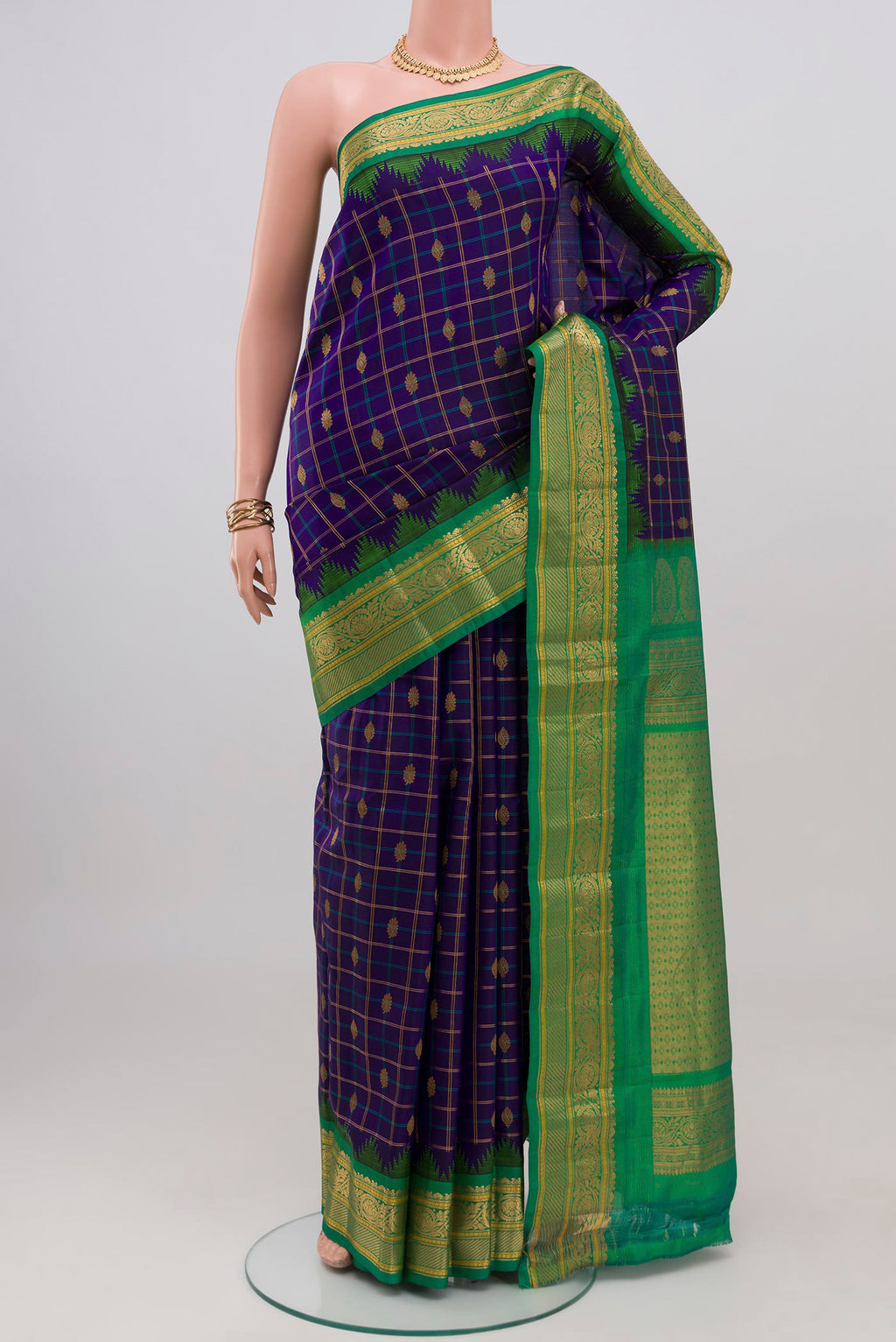 Dark Blue Gadwal Silk Saree with Checked design on the body and Zari Border.  displayed on a mannequin