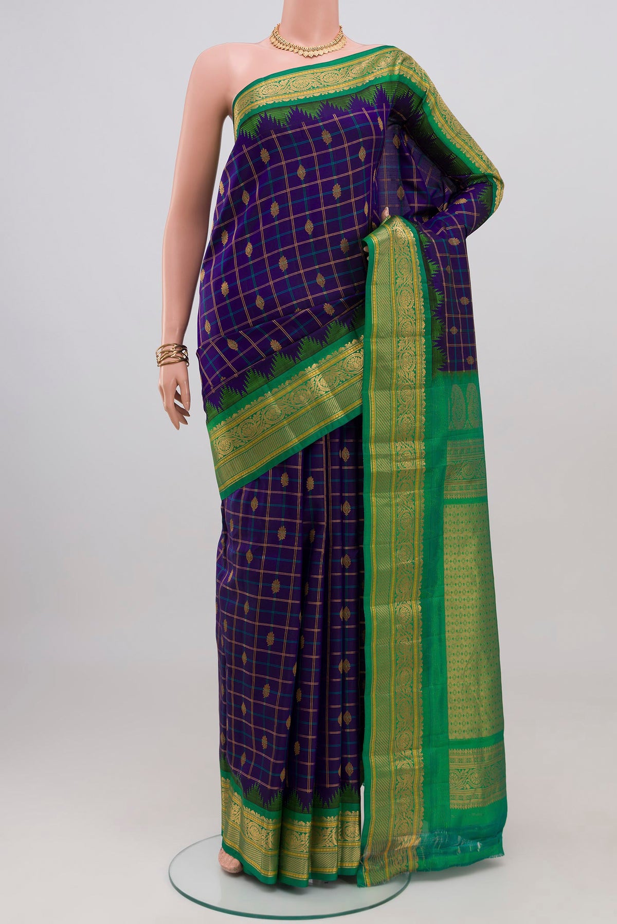 Dark Blue Gadwal Silk Saree with Checked design on the body and Zari Border.  displayed on a mannequin