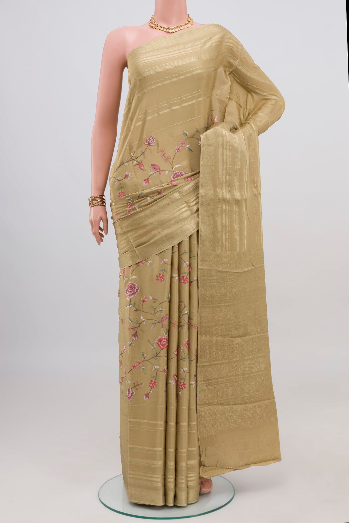 Beige Mysore Crepe Saree with Stripes on the body and Zari Border.  displayed on a mannequin