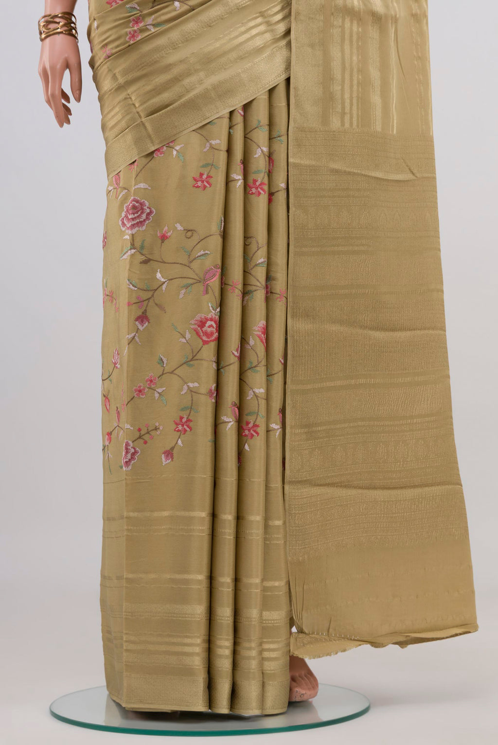 Pleats and pallu of Beige Mysore Crepe Saree with Stripes on the body and Zari Border. 
