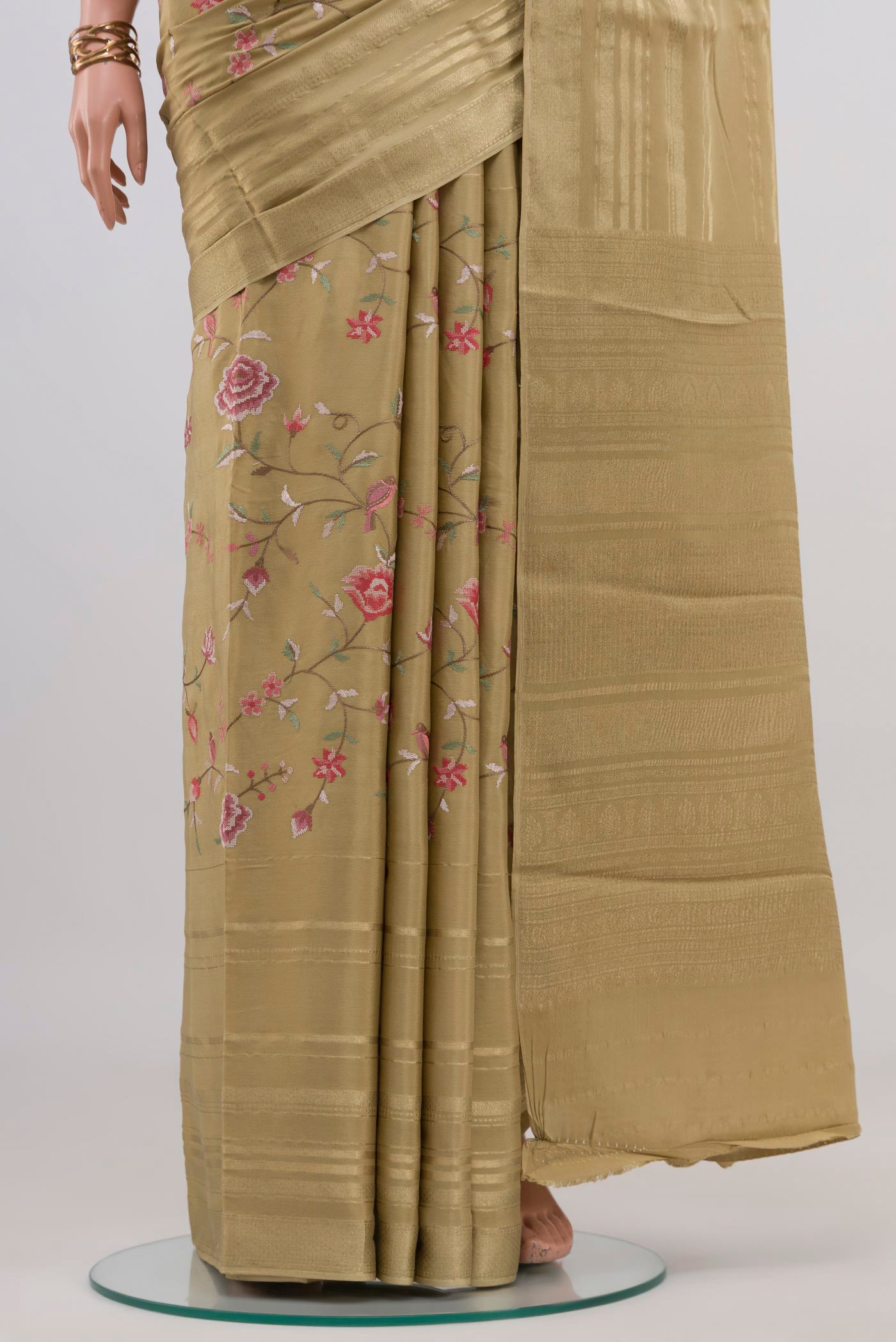Pleats and pallu of Beige Mysore Crepe Saree with Stripes on the body and Zari Border. 