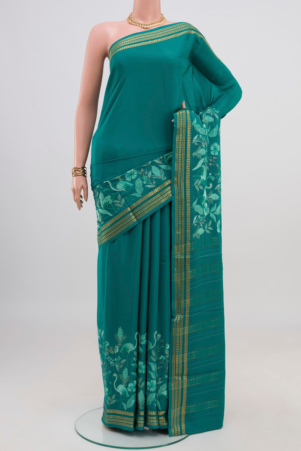 Blue Crepe Saree with Fancy on the body and Fancy Border.  displayed on a mannequin