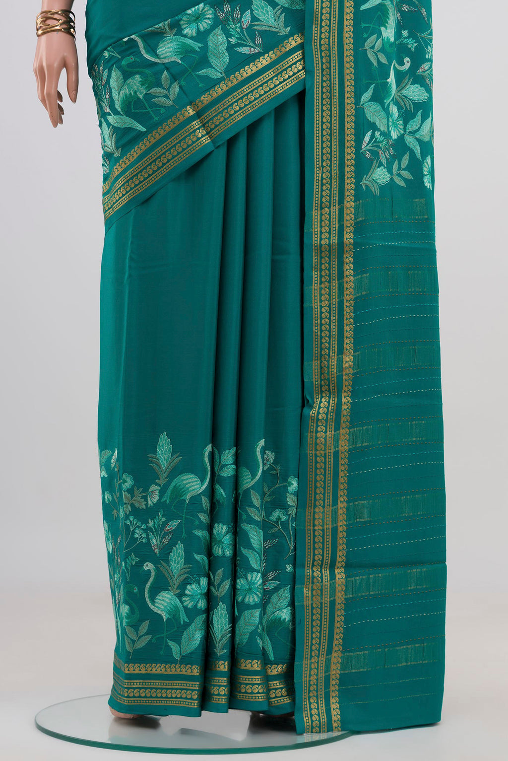 Pleats and pallu of Blue Crepe Saree with Fancy on the body and Fancy Border. 