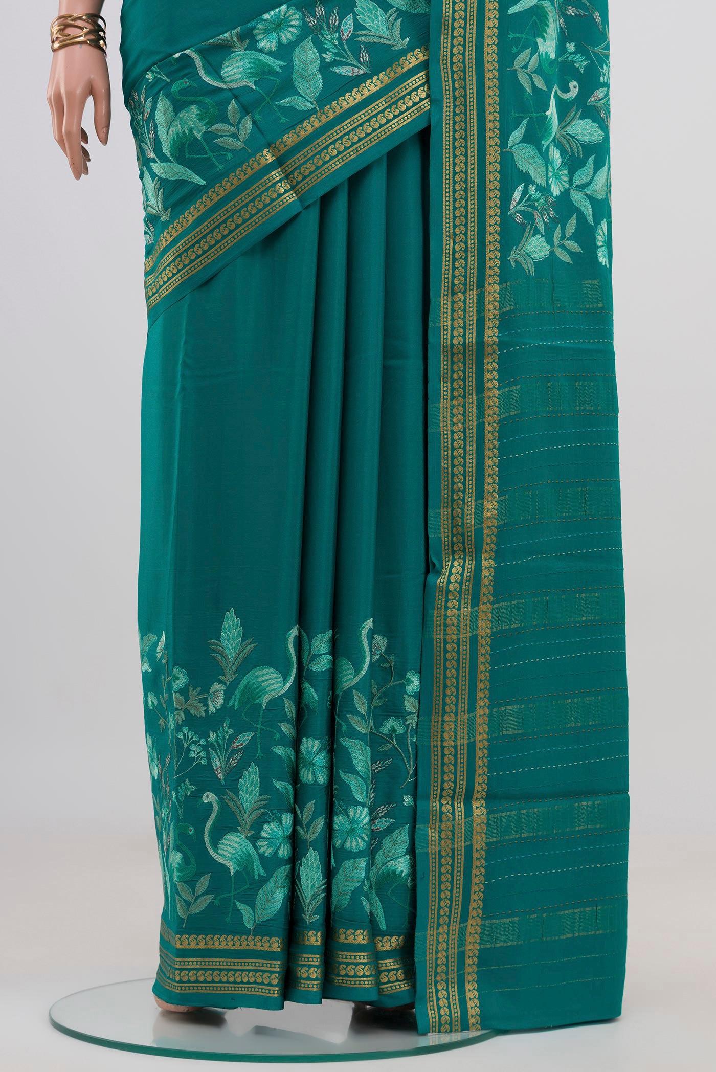 Pleats and pallu of Blue Crepe Saree with Fancy on the body and Fancy Border. 