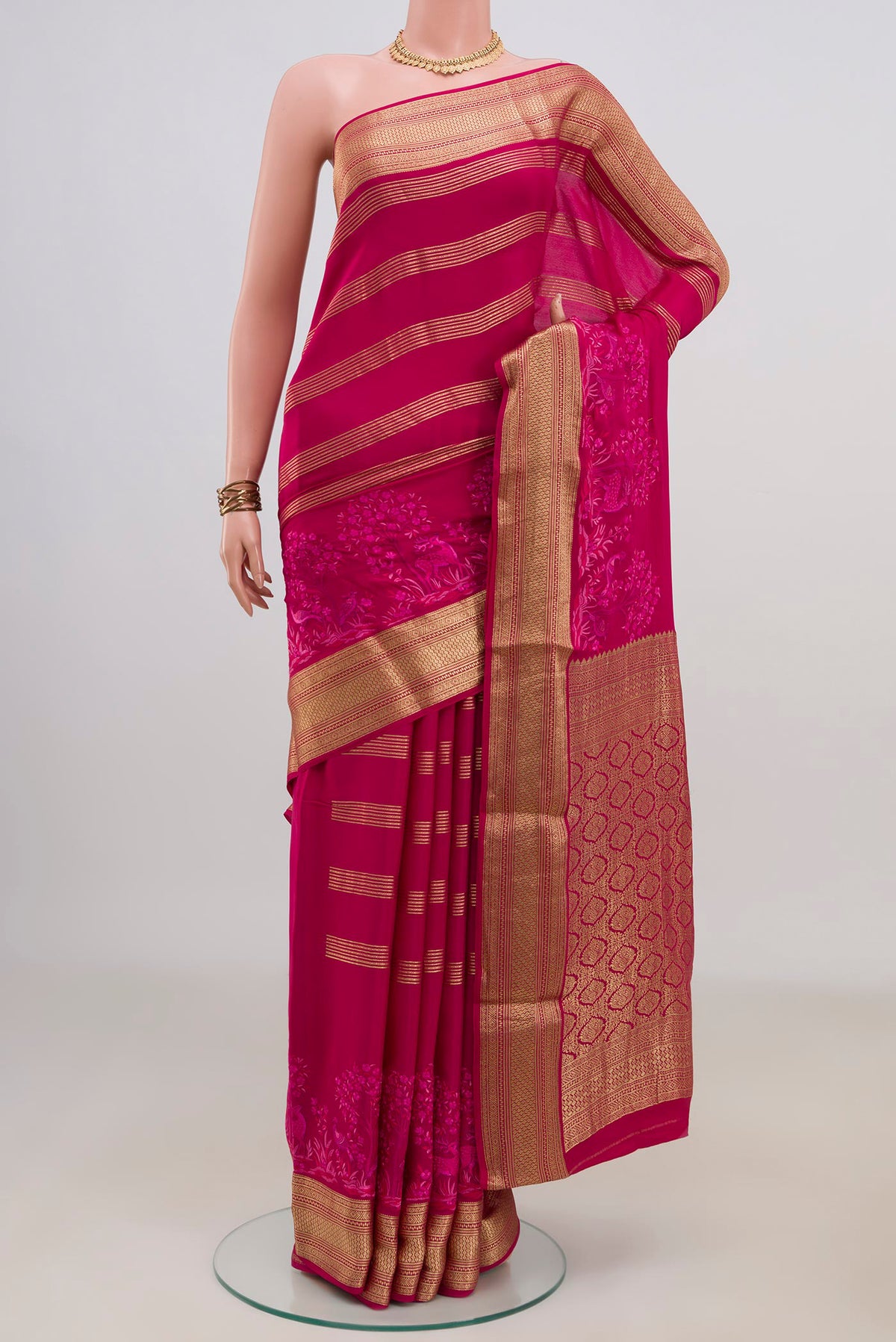 Pink Mysore Crepe Saree with Stripes on the body and Zari Border.  displayed on a mannequin