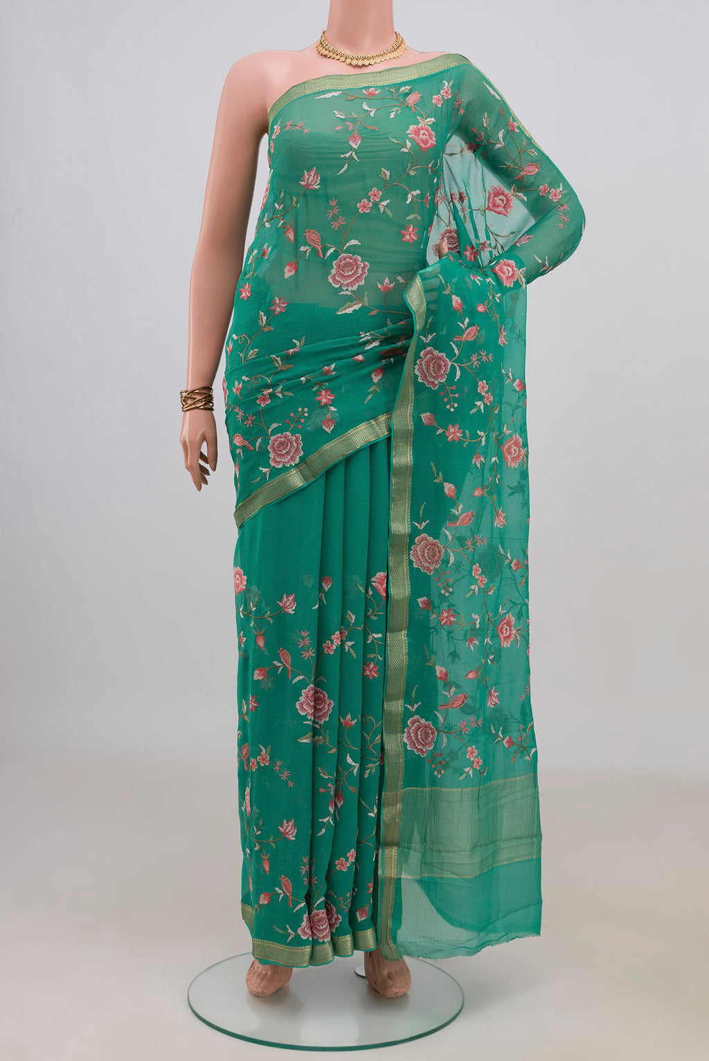 Sea Green Mysore Chiffon Saree with Embroidery on the body and Zari Border.  displayed on a mannequin
