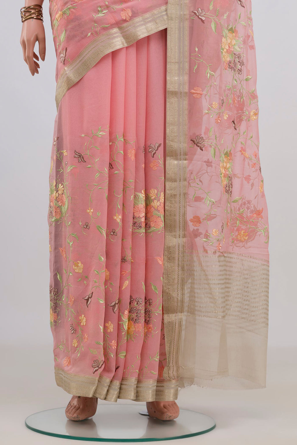 Pleats and pallu of Peach Mysore Chiffon Saree with Embroidery on the body and Zari Border. 