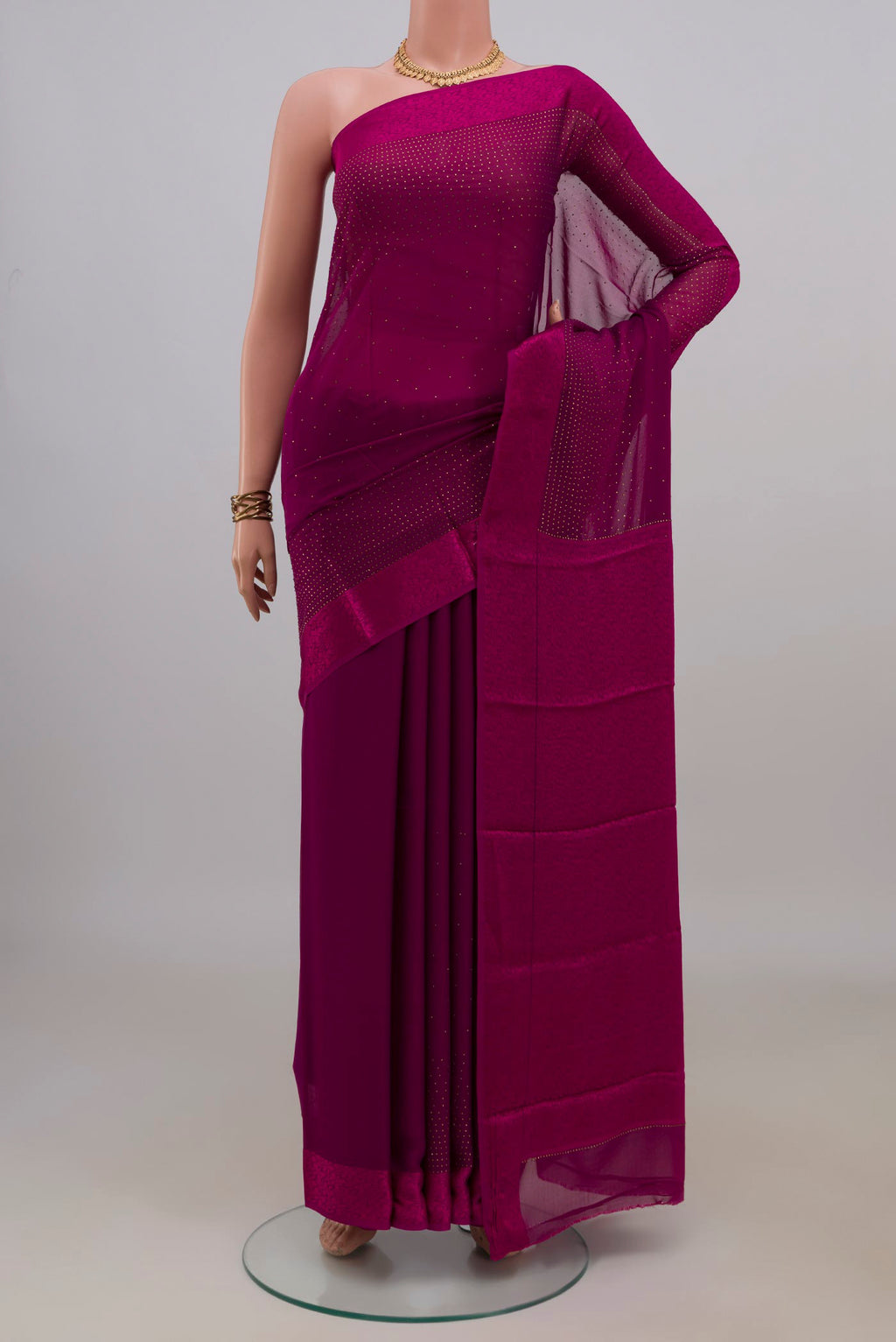 Magenta Mysore Chiffon Saree with Embroidery on the body and Thread Border.  displayed on a mannequin