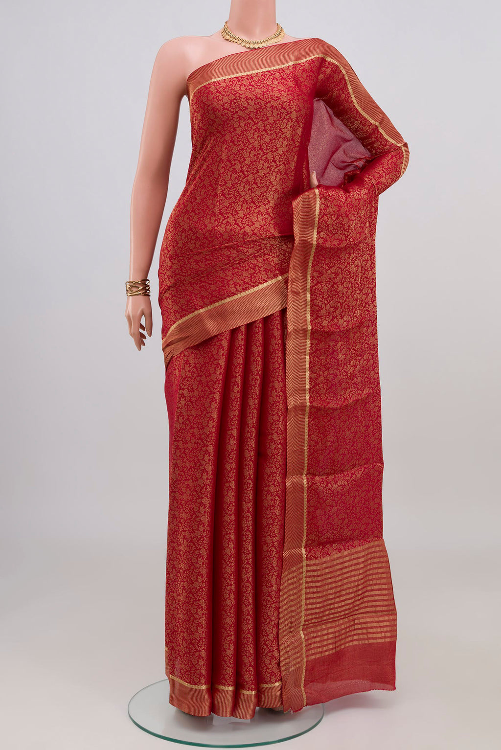 Red Mysore Crepe Saree with Zari Brocade on the body and Zari Border.  displayed on a mannequin