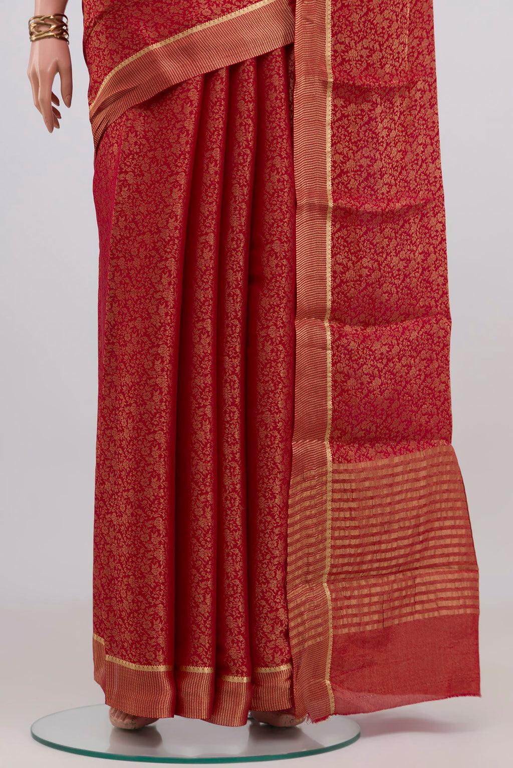 Pleats and pallu of Red Mysore Crepe Saree with Zari Brocade on the body and Zari Border. 