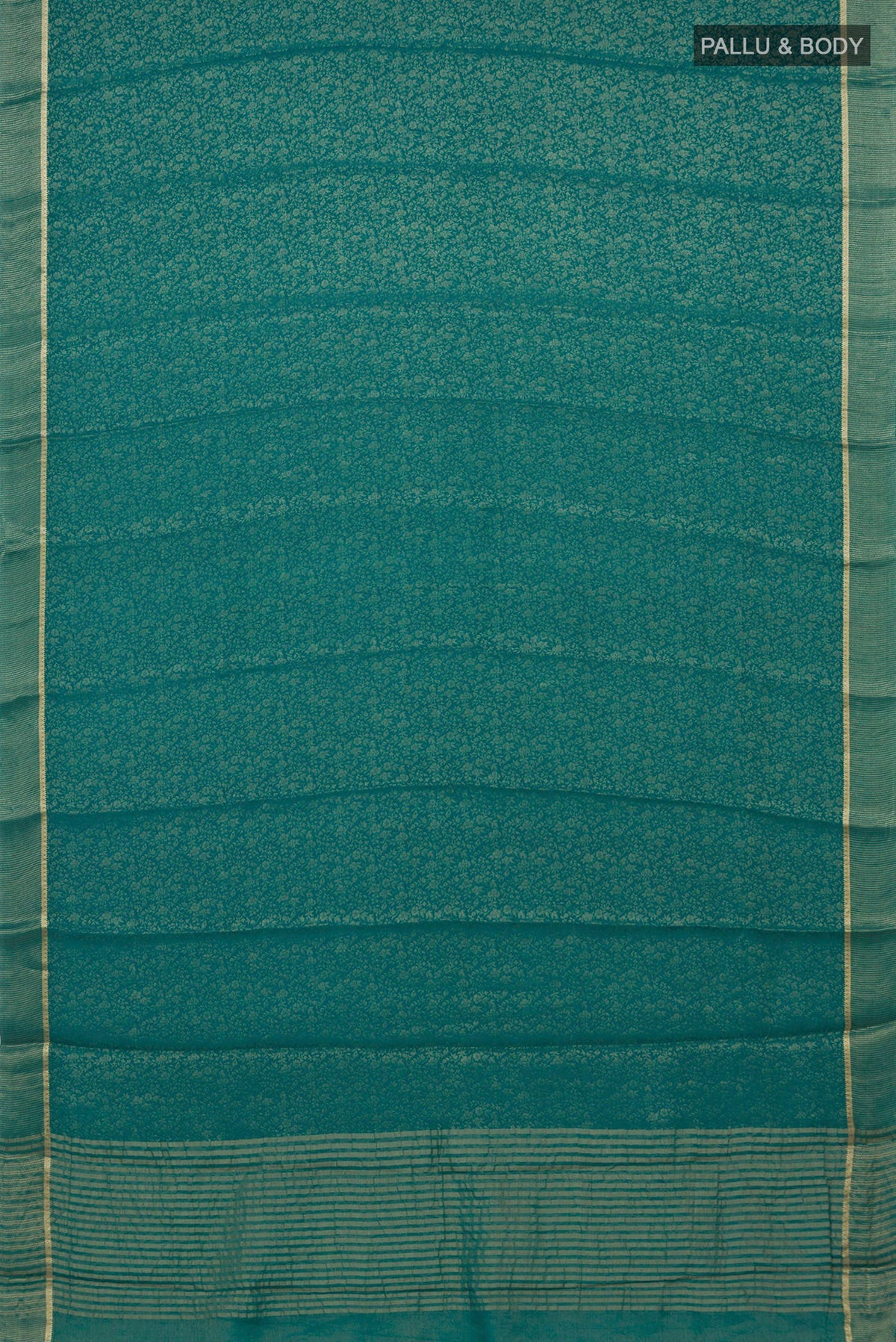 Flat view of Sea Green Mysore Crepe Saree with Zari Brocade on the body and Thin Zari Line. 