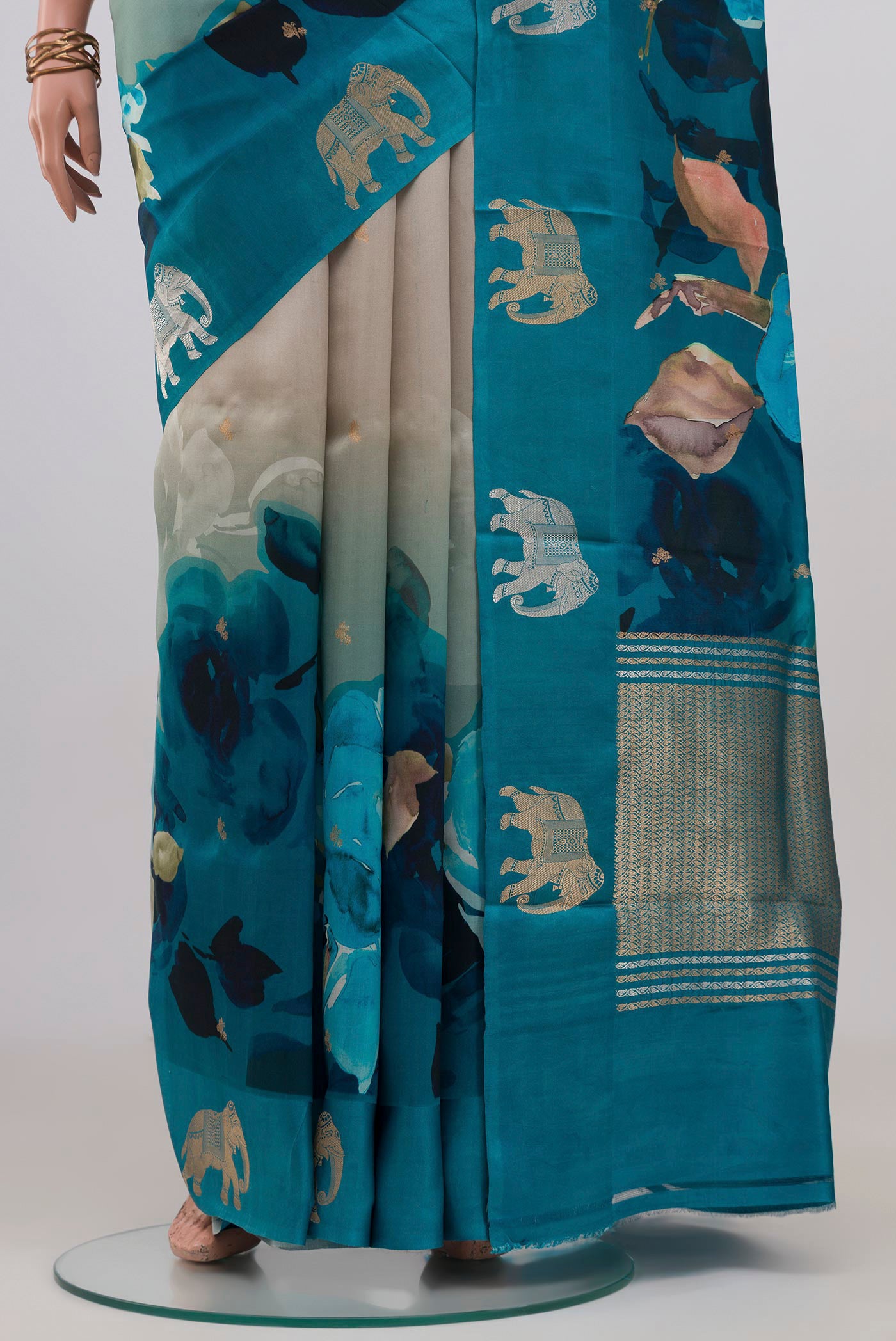 Pleats and pallu of Beige Banarasi Katan Silk Saree with Floral Print on the body and Fancy Border. 