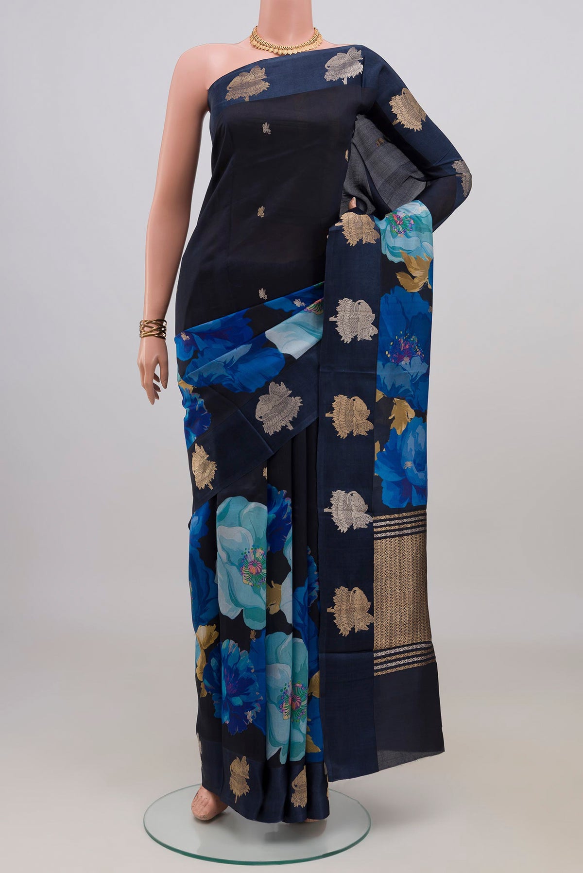 Navy Blue Banarasi Katan Silk Saree with Floral Print on the body and Fancy Border.  displayed on a mannequin