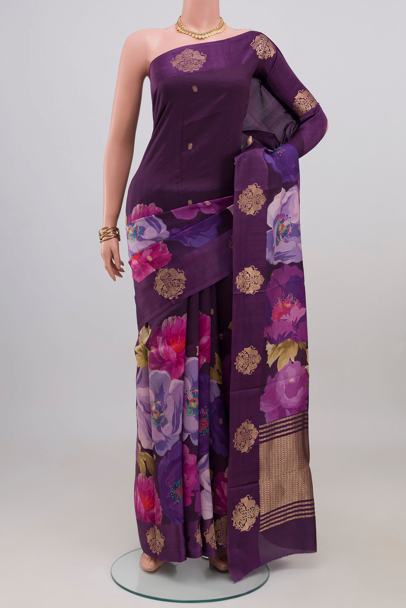 Purple Banarasi Katan Silk Saree with Zari Butta on the body and Fancy Border.  displayed on a mannequin