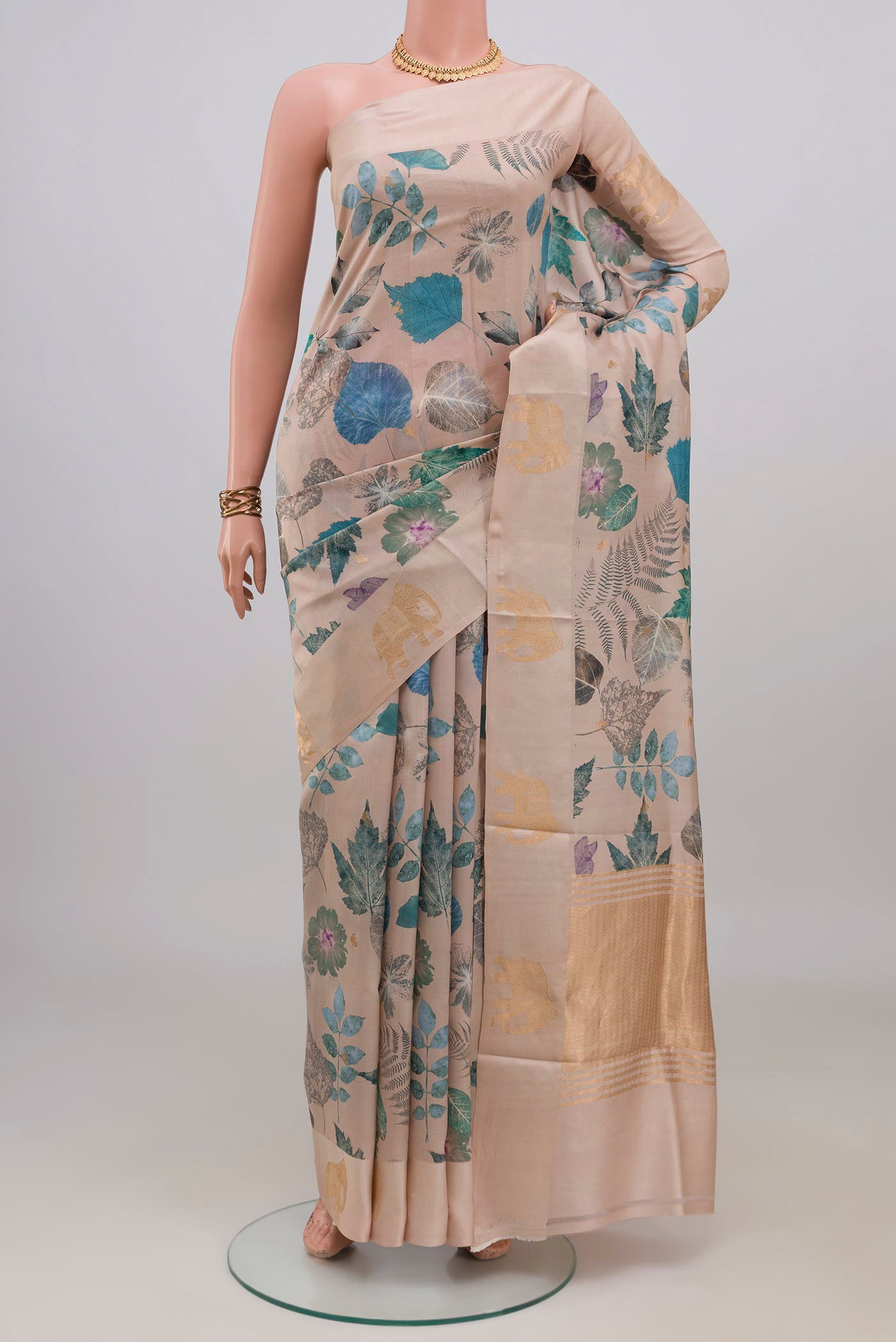 Cream Banarasi Katan Silk Saree with Floral Print on the body and Fancy Border.  displayed on a mannequin