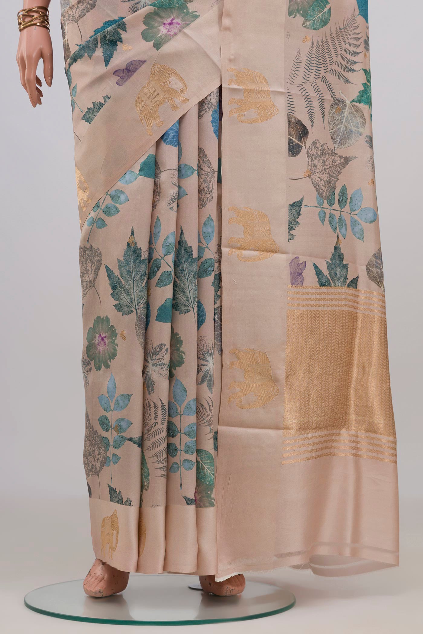 Pleats and pallu of Cream Banarasi Katan Silk Saree with Floral Print on the body and Fancy Border. 