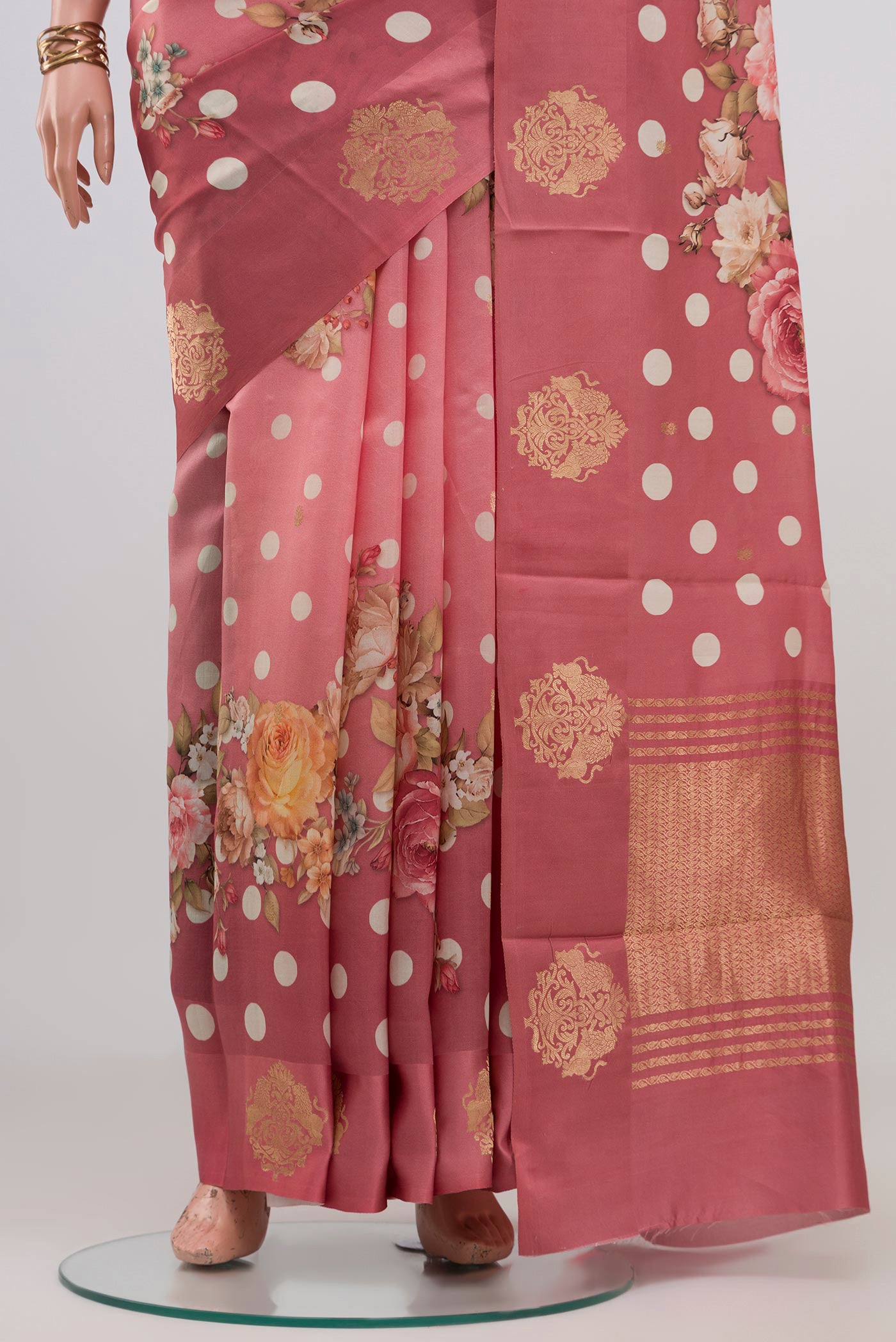 Pleats and pallu of Pink Tussar Silk Saree with Printed design on the body and Fancy Border. 