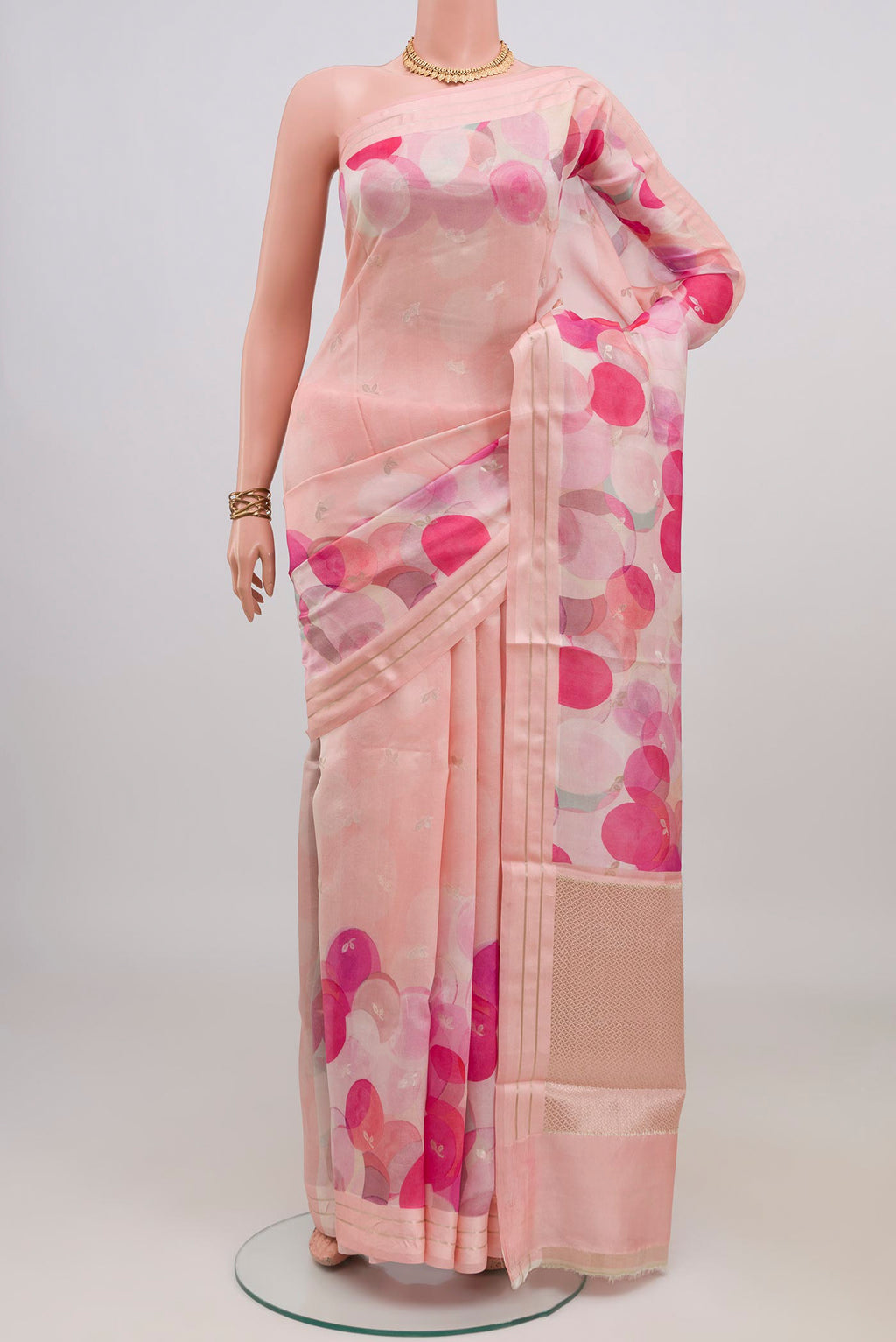 Rose pink Banarasi Katan Silk Saree with Floral Print on the body and Thin Zari Line.  displayed on a mannequin