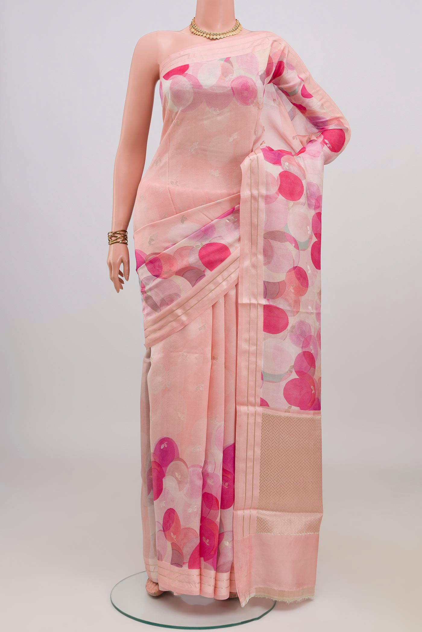 Rose pink Banarasi Katan Silk Saree with Floral Print on the body and Thin Zari Line.  displayed on a mannequin