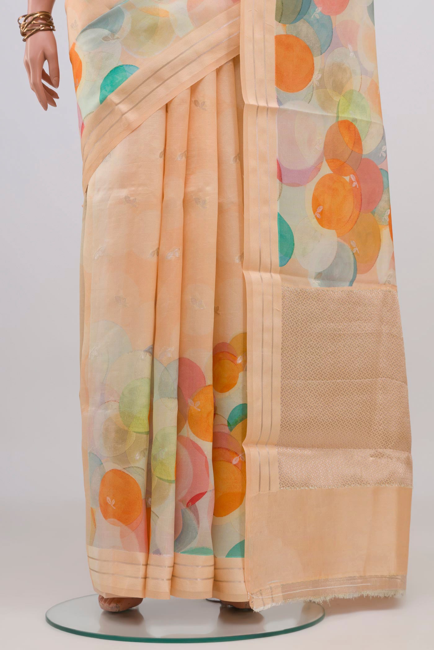 Pleats and pallu of Peach Banarasi Katan Silk Saree with Printed design on the body and Satin Border. 